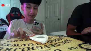 PLAYING THE OUIJA BOARD