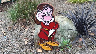 Grumpy cartoon character cut out on plywood and inlayed with resin, scroll saw project..