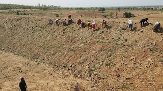 Preparing the pond surface for the laying of HDPE Geomembrane