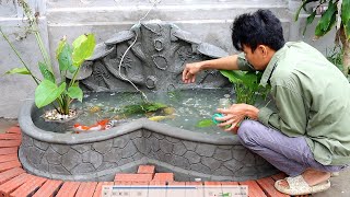 Create a kidney-shaped fish tank with a beautiful waterfall for a cement garden