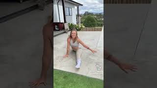 Gymnastics in her white socks outside