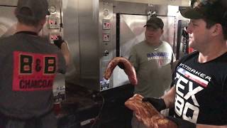 Operation BBQ Relief Loading Pork Loins Into The Smoker In Houston