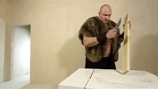 Knife test. Big Man cuts a wooden plank with a GrandWay knife.