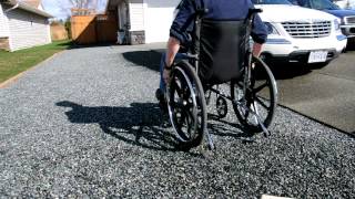 Wheelchair on CORE gravel driveway