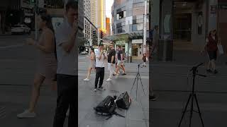 Busker singing in Sydney shopping area