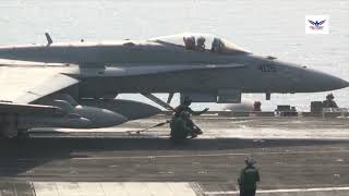 Aircraft aboard USS George H.W. Bush (CVN 77) conduct flight deck operations