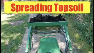 John Deere 3038E TRACTOR - Spreading topsoil with bucket