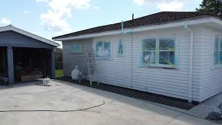 How To Airless spraying weatherboards.