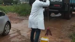 doctor mopping the ground after a flood.