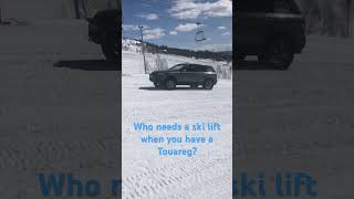 VW Touareg driving up ski slope #automobile #offroad #snow