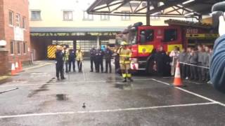 Firefighters demonstrating what happens when flammable liquid is poured on a bonfire