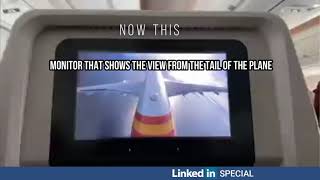 Monitor that shows the view from the tail of the plane