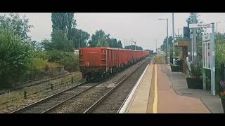 EWS liveried 66013 & Freightliner liveried 66613 heading through Whittlesea towards Peterborough.