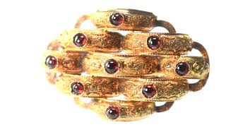 A GEORGIAN GILT METAL AND GARNET SET BROOCH