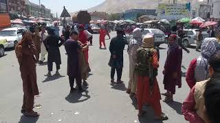 Taliban flags wave on buildings in Kandahar