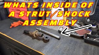 WHAT'S INSIDE A STRUT ASSEMBLY! LET'S TEAR IT DOWN AND SEE WHAT'S INSIDE!