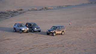 Suzuki Sidekick Sport on the sand dunes