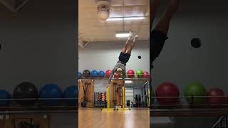 Man Attempts Handstand but Loses Balance and Falls - 1537237