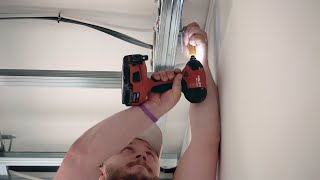 Fitting a screw in a hard-to-reach place.