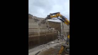 Brokk Punching thru 12" Thick Wall w/ Wide Elephant Foot