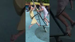 Margot Spinning Around at Playground