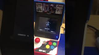 Neo Geo mini portable playing MOTW using a portable battery pack