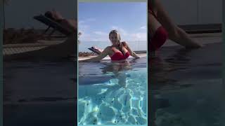 Girl relaxing in the swimming pool