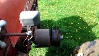 Rolling up fence wire with Farmall 400 belt pulley