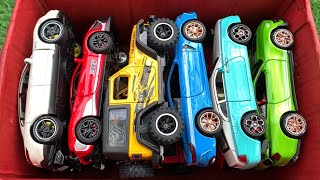 Box Full of Diecast Car /Porsche Taycan, Ferrari 488, BMW M8, Rolls-Royce Wraith, Jeep, Ford Mustang