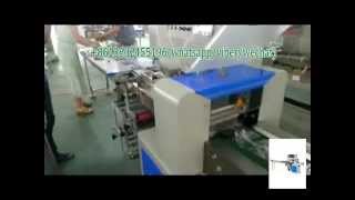 Automatic flow packing machine for hardware products