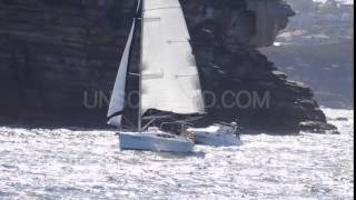 Sailboat Tacks Near Coastline (Stock Footage)