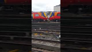 *one of the last 707s on SWR* 707024 and 707030 leave Clapham Junction for Waterloo