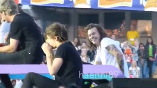 Louis and Harry giggling over a balloon