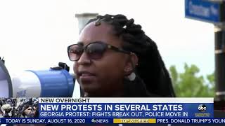 Armed militia groups face off against counter protesters in Georgia