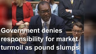 Government denies responsibility for market turmoil as pound slumps