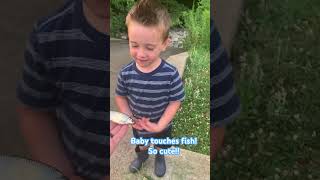 Catching fish and letting my son hold them