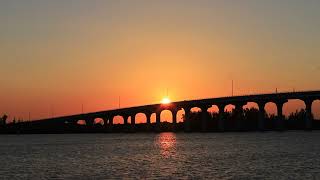 Golden Tranquility: Calm River Waters and Bridge at the Magic Hour 🌅🌉