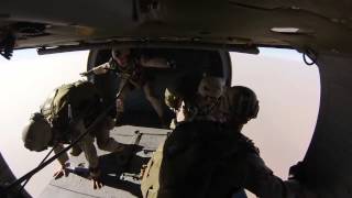 Force Recon Marines Parachute From Black Hawk Helicopter