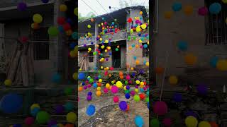 More than 1000 rainbow balls colorful balls falling from the roof