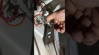 Installing a new restring heating element on this dryer.