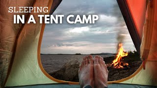 Rest in a tent with a campfire in front of the lake.