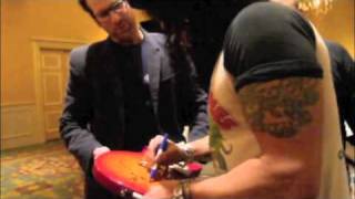 Slash draws a picture & signs a GnR guitar for The Signature Library