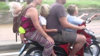 Stupid tourists family of 5 people "squids" riding motorcycle dangerously with NO helmets.