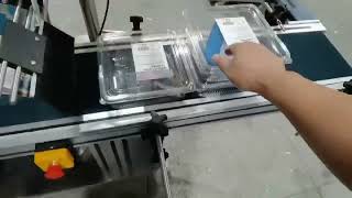 Automatic tray adhesive labeling machine