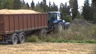 New Holland TM165 Pulling Grain Trailer