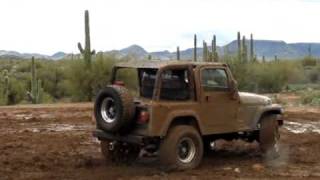 Jeep TJ doing donuts in the mud