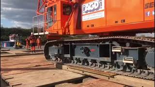 Sennebogen 6100HD 100 tons crawler crane loaded onto floating barge