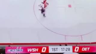 Ovi and Ovi-jr watching video game "Caps" vs "Red Wings" on television during pandemics