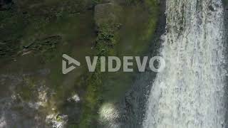 Peaceful woodland forest splashing waterfall slow motion flowing paradise wilderness closeup rising