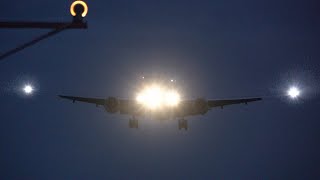 Omni Air International 777-200 evening landing at BWI